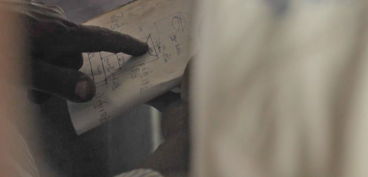 Hand pointing at the biodigester map