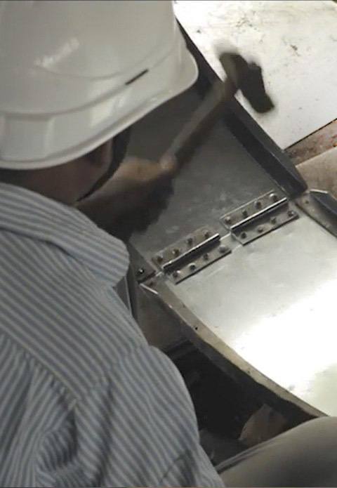 Worker building a biodigester
